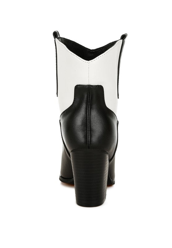 Two-tone cowboy boots, black lower with white shaft and stacked block heel