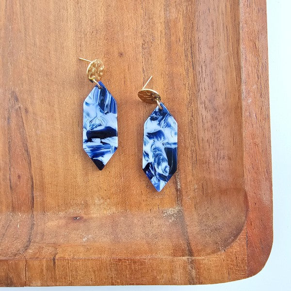 Pair of blue ocean-wave teardrop earrings with gold tops, shown side by side