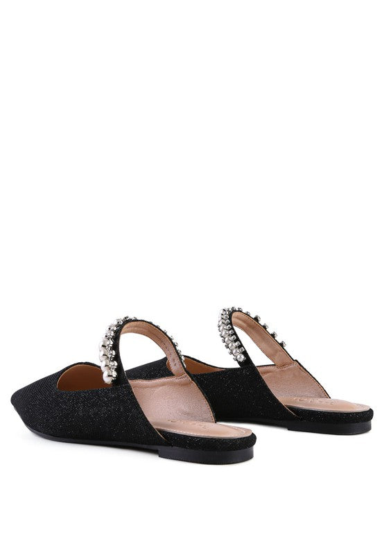 Black embellished mules with beaded strap and flat sole, side-by-side view