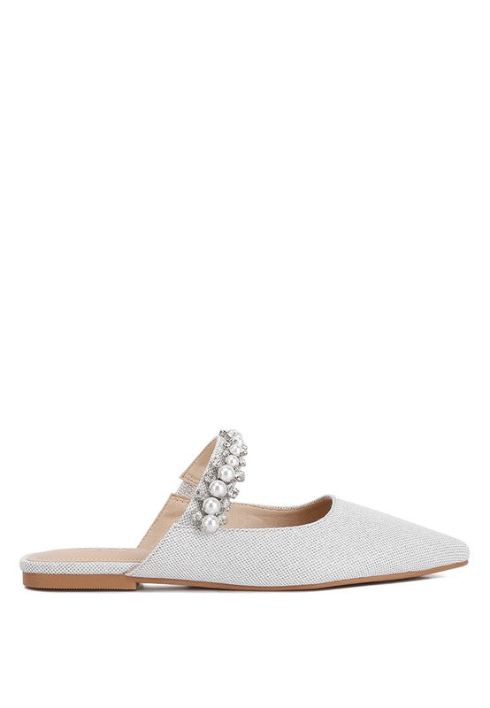 Light beige mule with pearl-and-rhinestone strap, flat sole and open upper