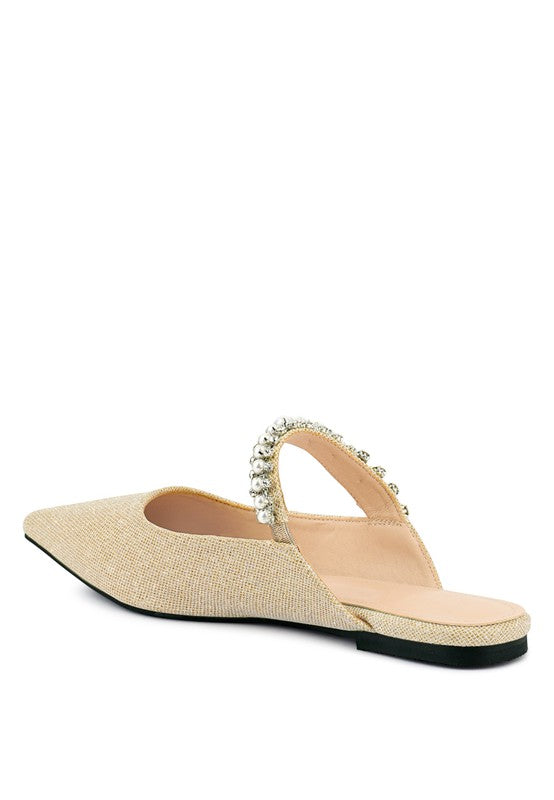 Beige embellished mule with pearl bead toe strap and black outsole