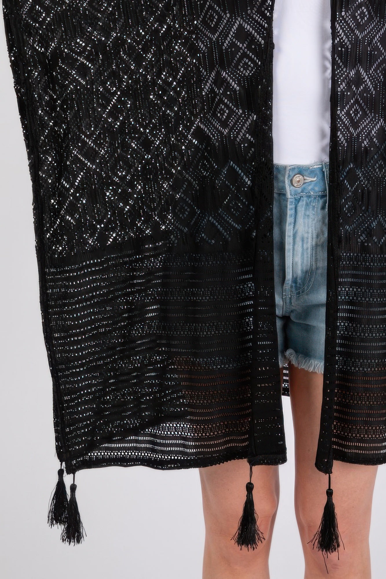 Black geometric tassel cover-up hem with dangling fringe detail