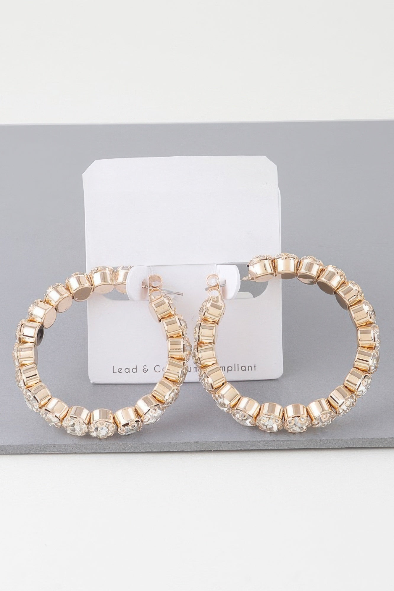Geometric rhinestone cut hoop earrings, gold-tone with clear stones