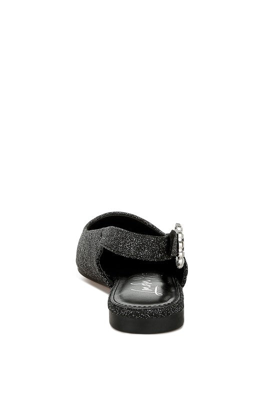 Heel view of black glitter point-toe slingback flats with buckle detail