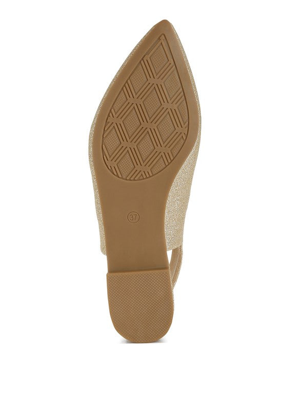 Gold glitter point-toe slingback flat sandal outsole with geometric tread pattern