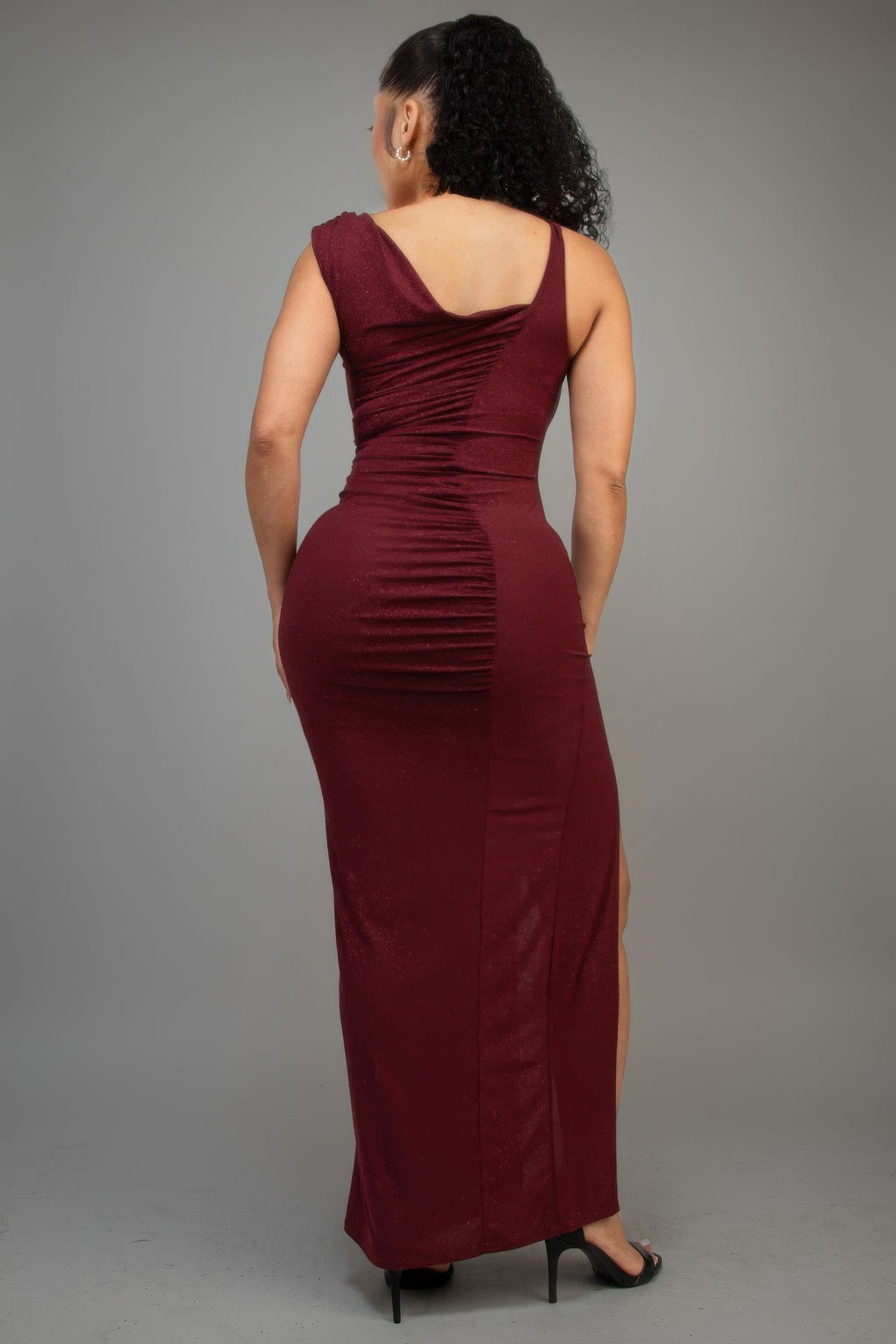 Back view: burgundy glitter sleeveless ruched maxi dress with back drape
