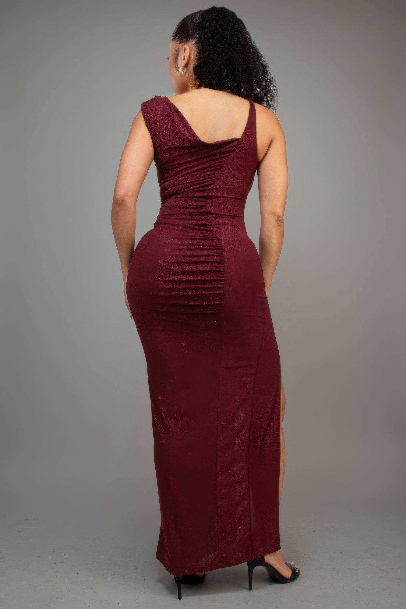 Back view: burgundy glitter sleeveless ruched maxi dress with back drape