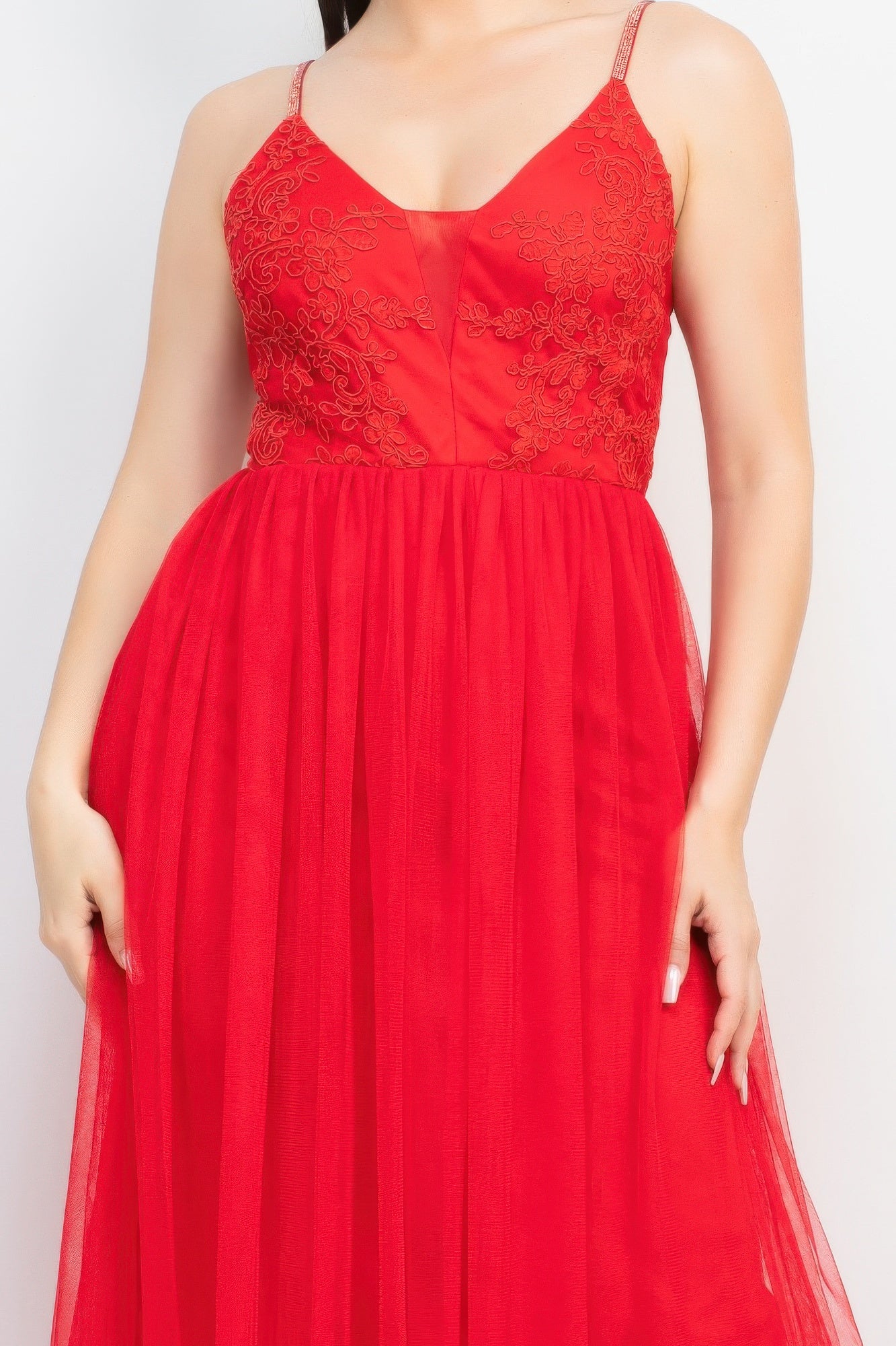 Red bodice of mesh tulle with glitter straps and gathered waist, detail view