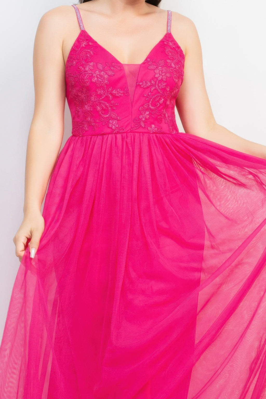 Hot pink embroidered mesh bodice with glitter straps and flowing tulle skirt close-up