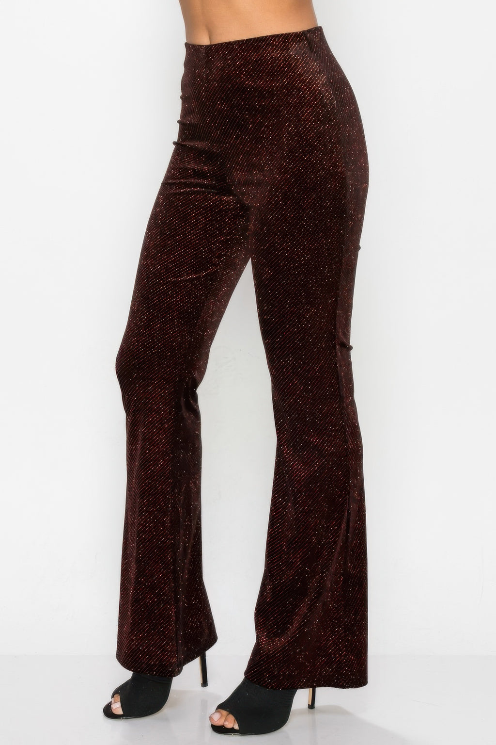 Glittery flare high-rise pants, burgundy glitter fabric, side view of legs