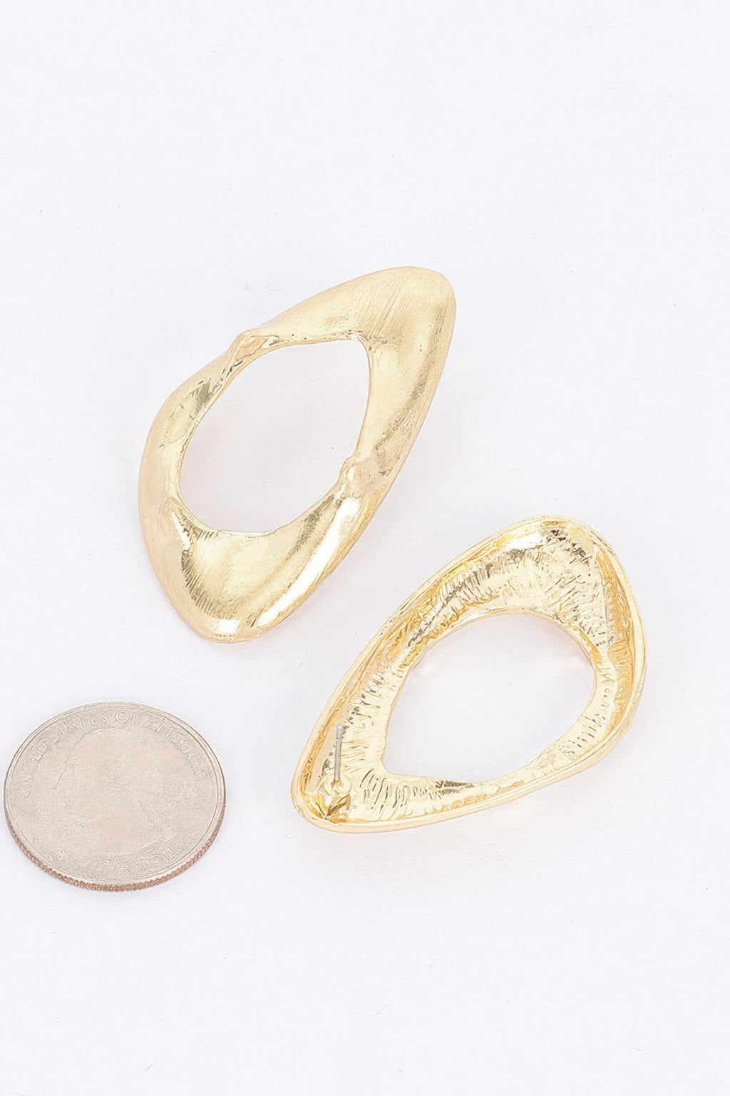 Pair of gold-plated open oval hoop earrings with hammered texture