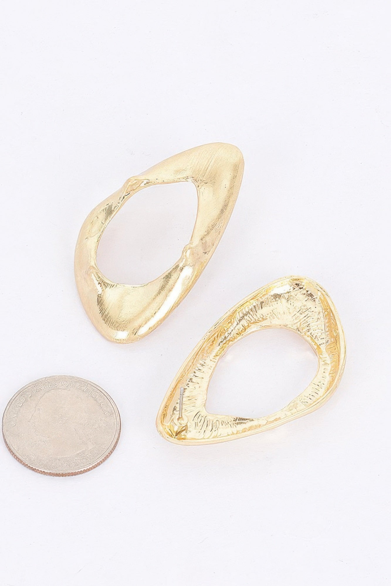 Pair of gold-plated open oval hoop earrings with hammered texture