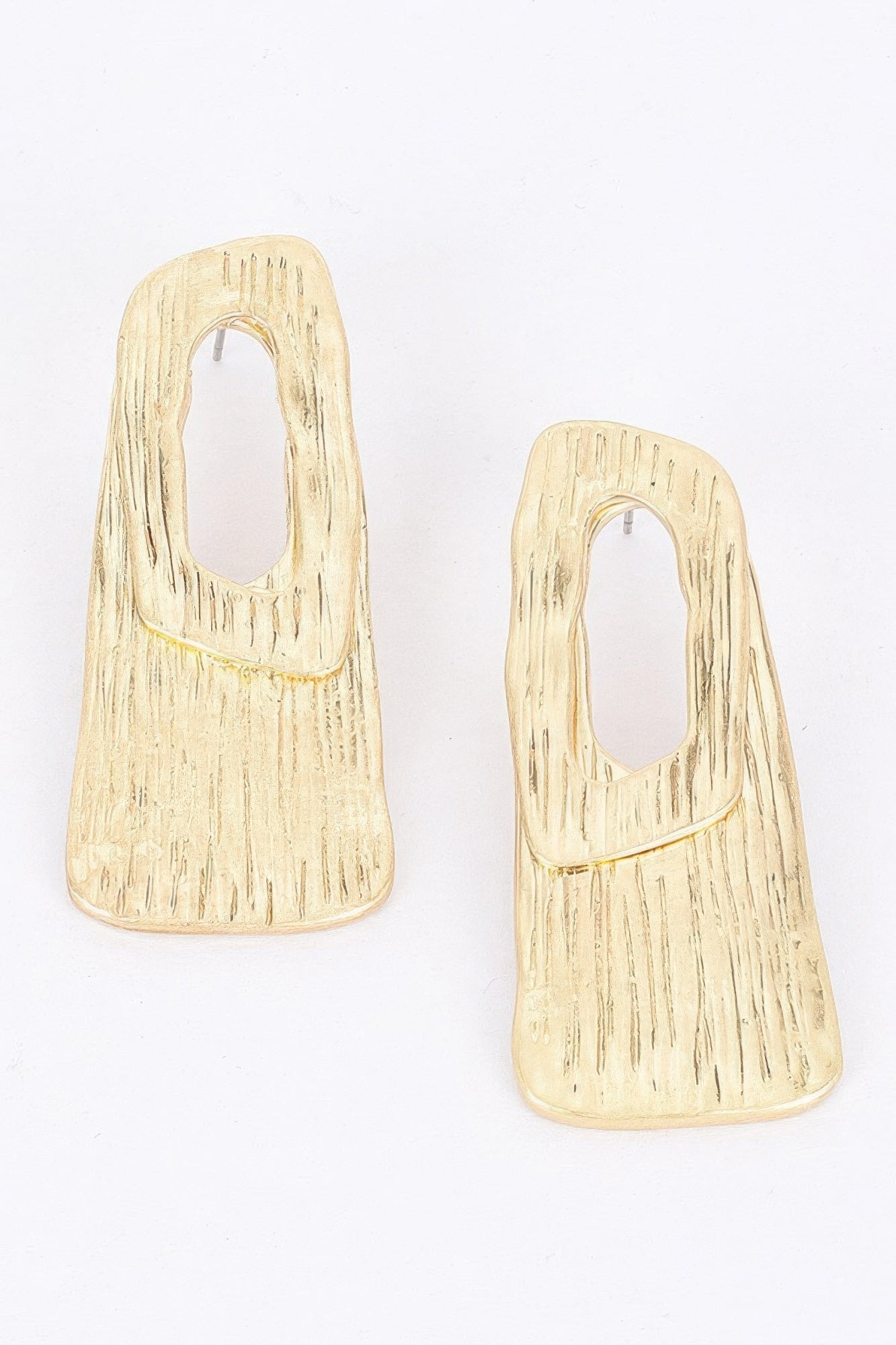 Gold plated metal earrings, textured geometric drop with oval cutouts
