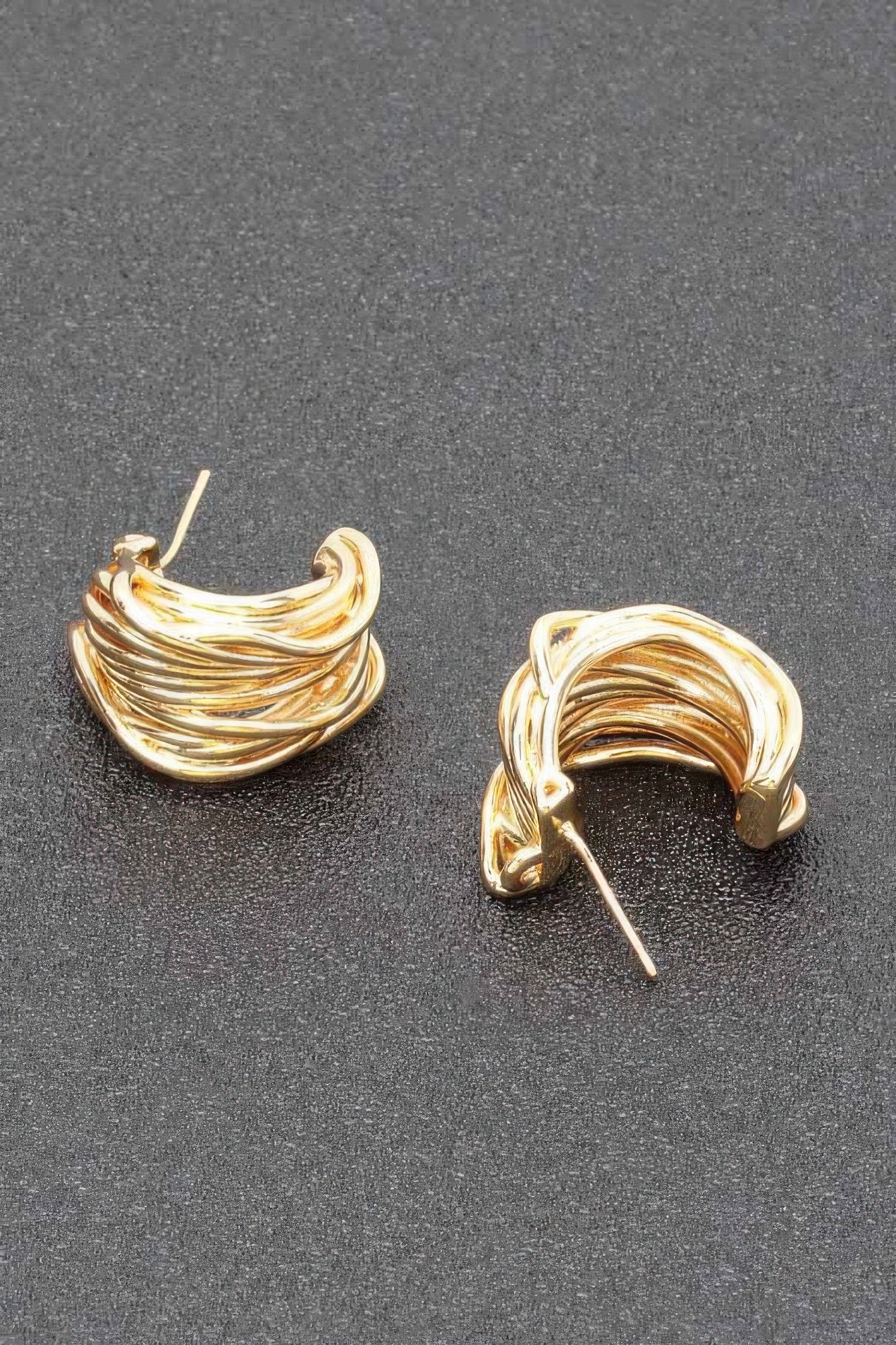 Gold-plated twisted swirl hoop earrings, side view with stud posts