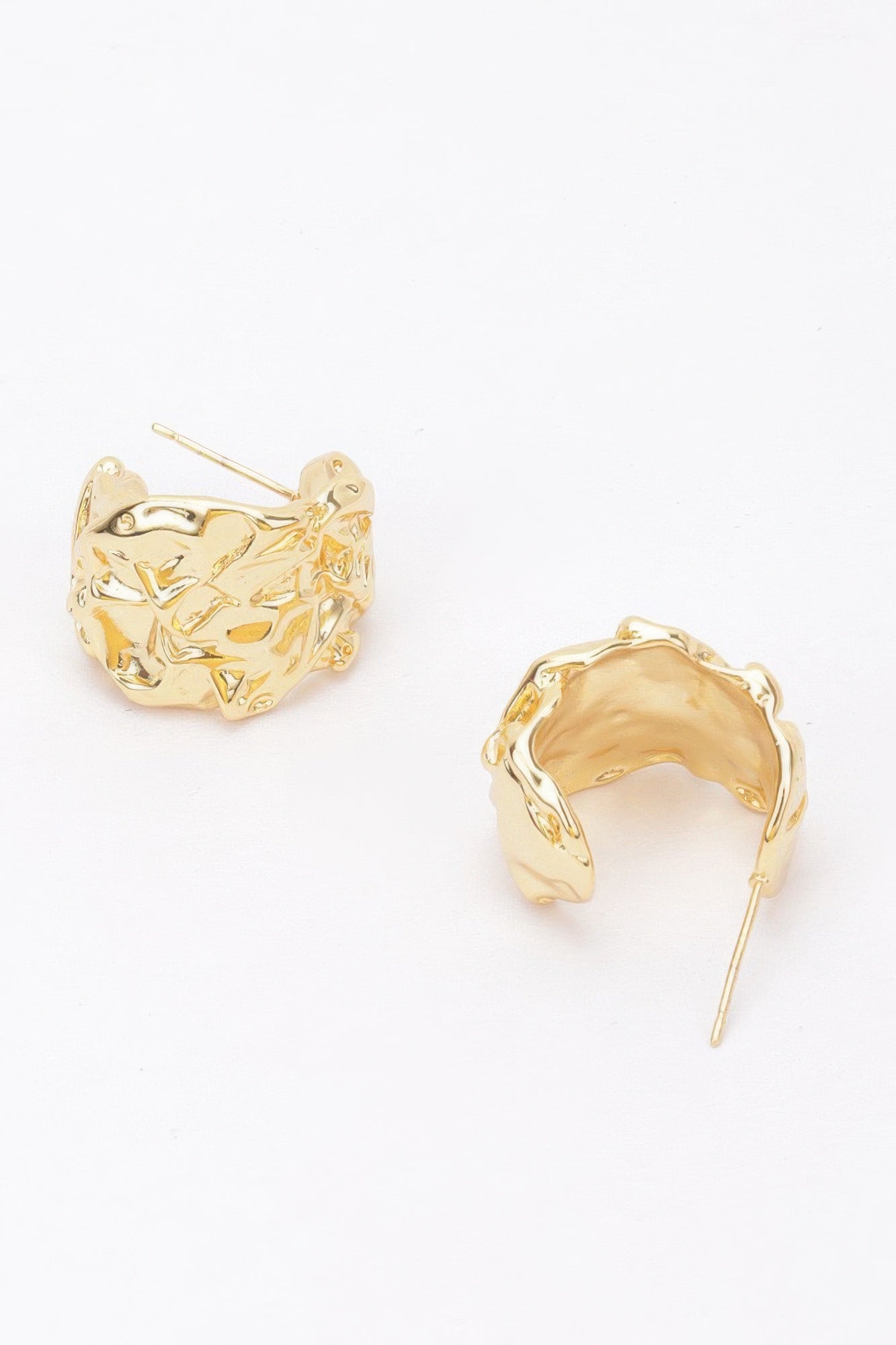 Gold-plated crescent earrings, textured finish; curved post back hardware visible