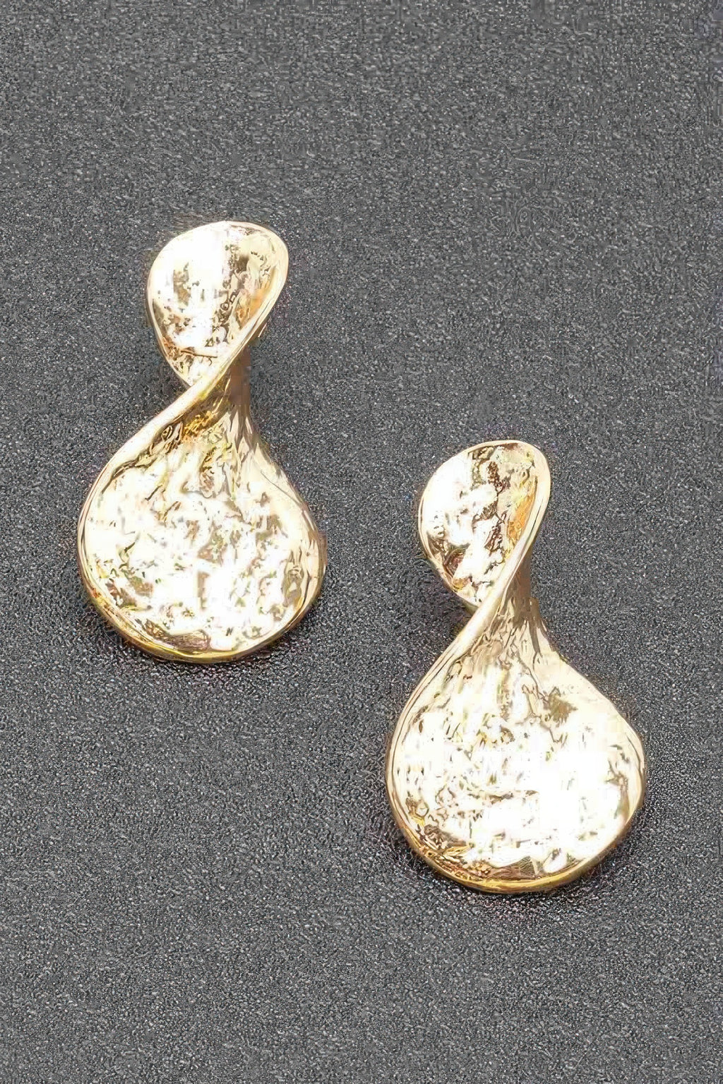 Gold plated teardrop metal earrings with irregular marbled texture and gold rim