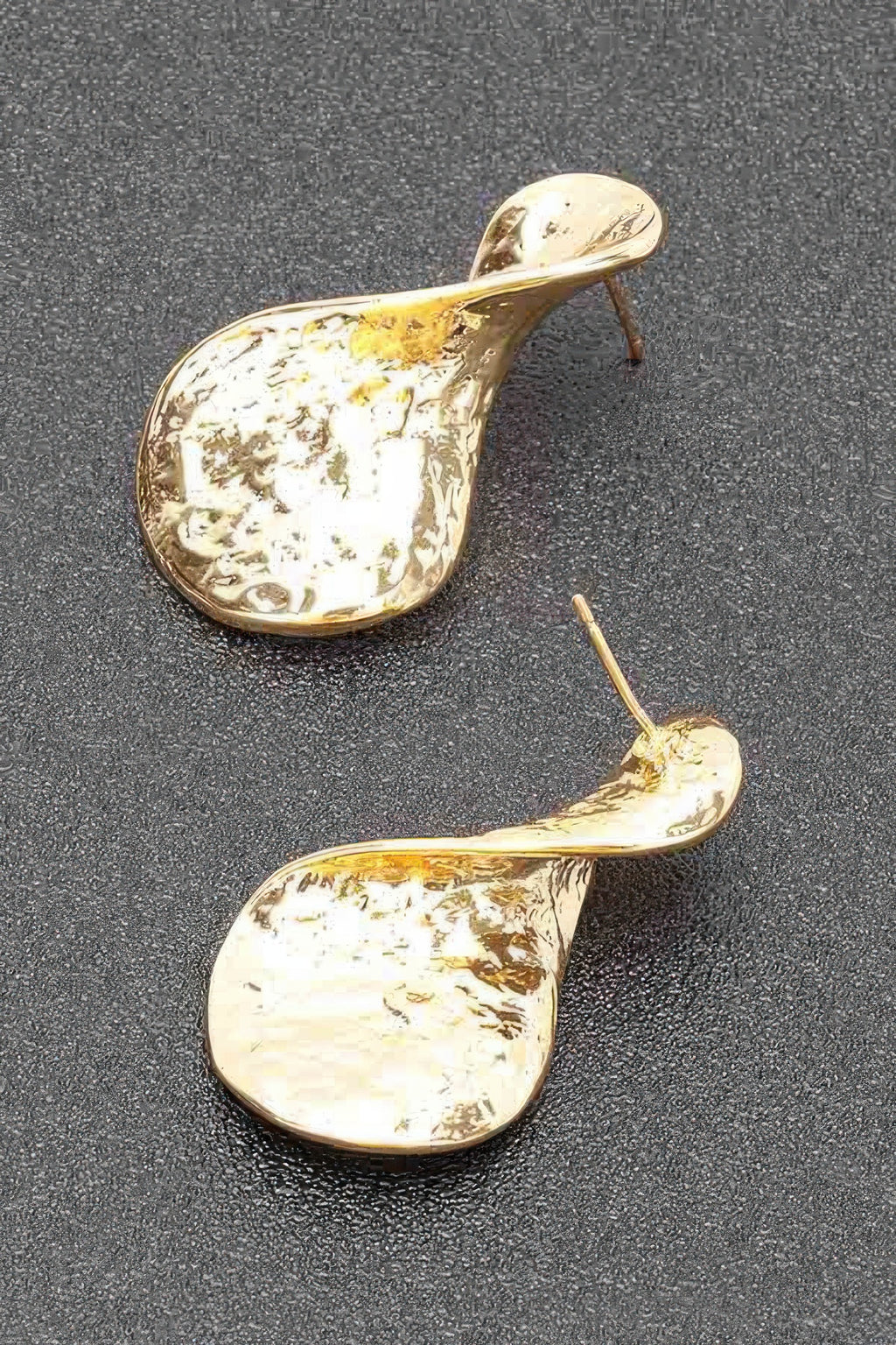 Gold plated curved teardrop earrings with metal post backing and speckled texture