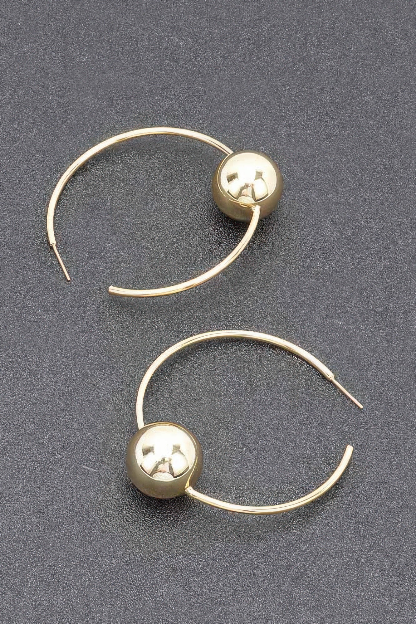 Gold hoop earrings, round ball topper on hinged-style hook, glossy finish