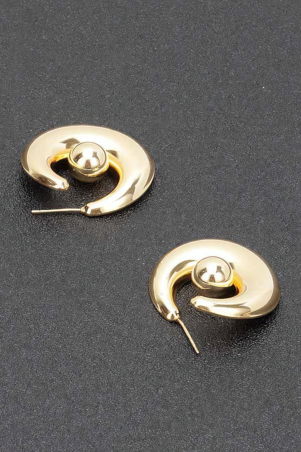 Gold plated hoop earrings with visible needle posts and round ball centers