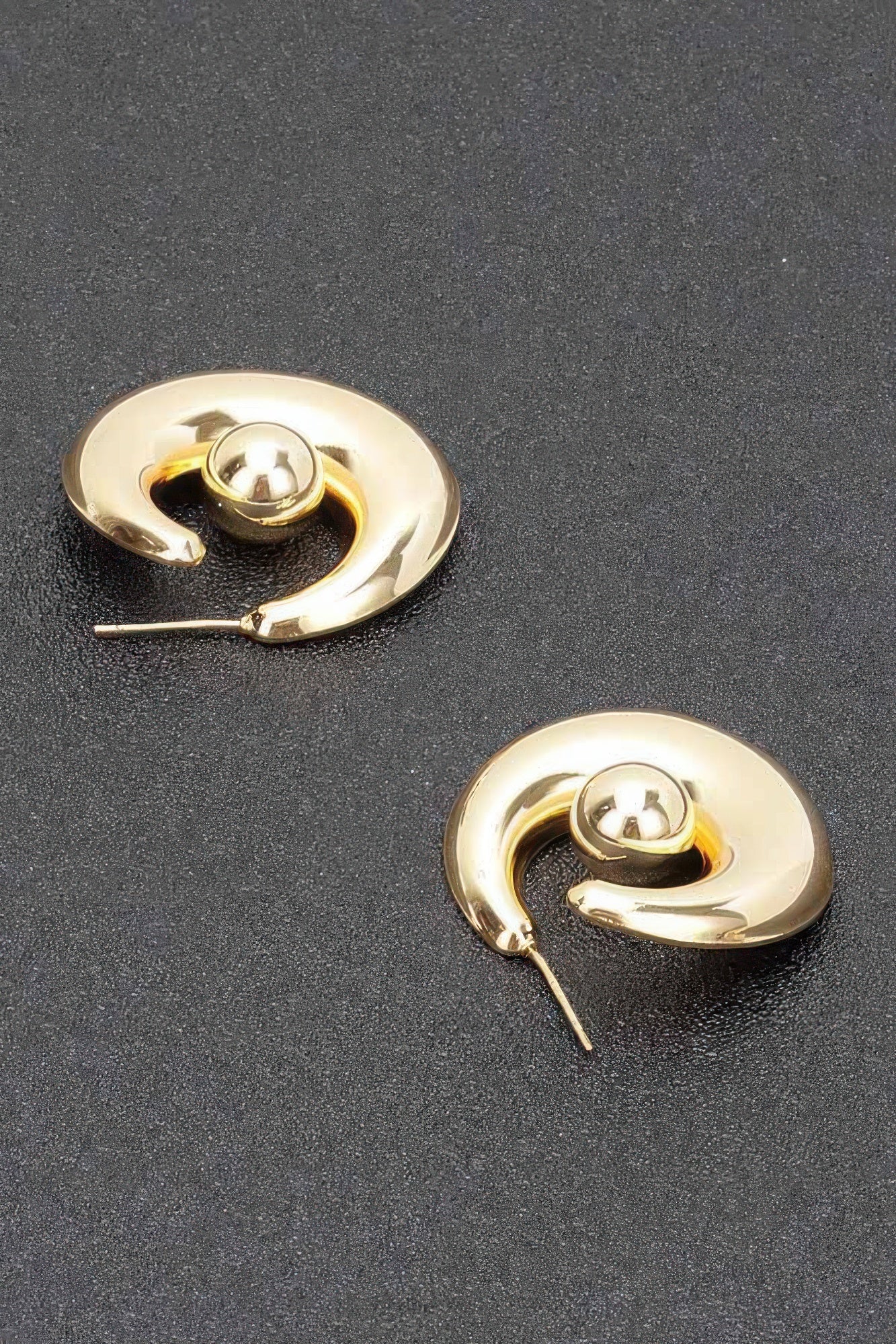 Gold plated hoop earrings with visible needle posts and round ball centers