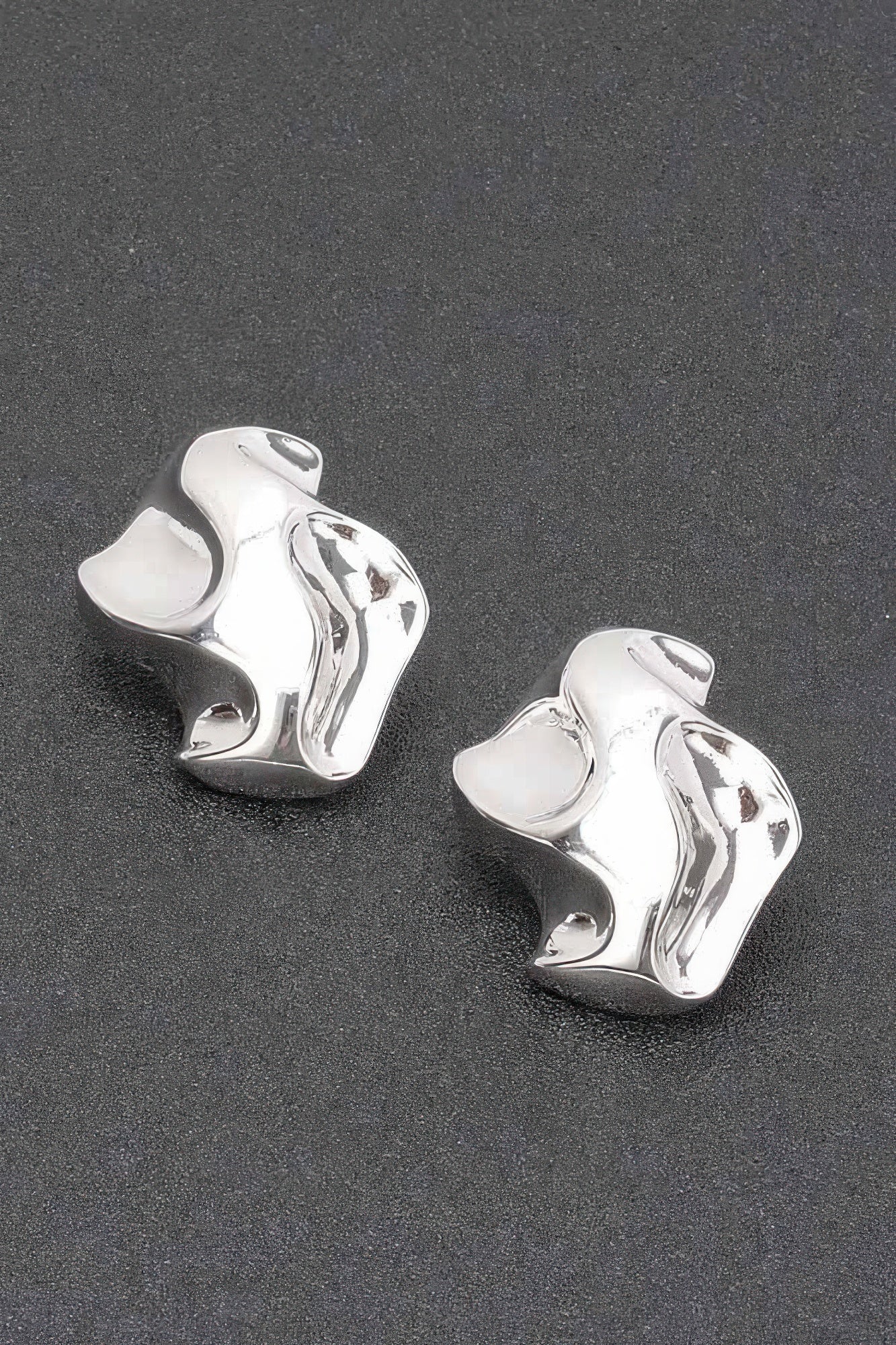 Silver plated metal earrings, wavy heart-cuff stud design