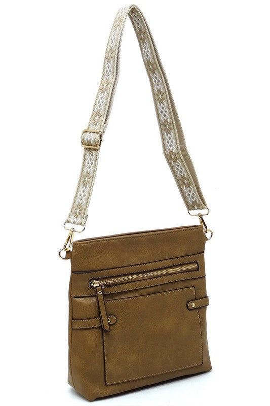Olive-brown crossbody bag with front flap pocket and patterned shoulder strap