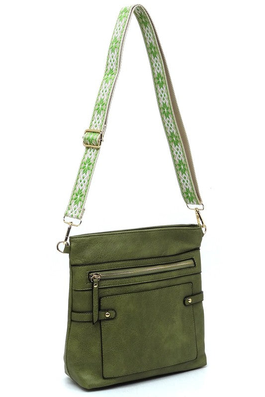 Olive guitar strap crossbody bag with front zip pocket and adjustable patterned strap