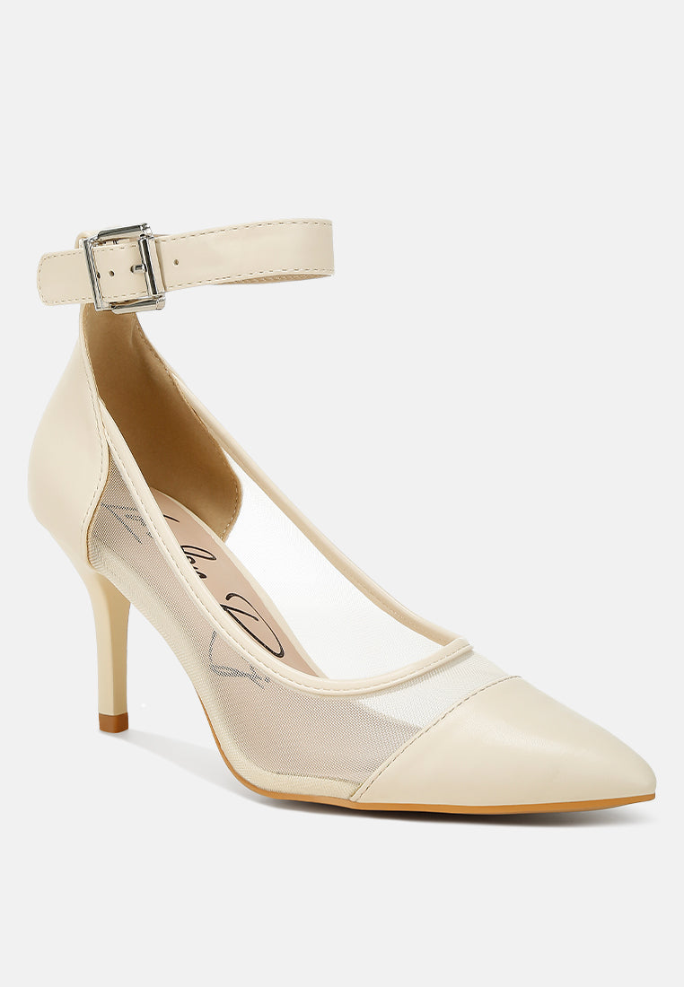 Beige pointy toe ankle strap pumps, angled side view with silver buckle