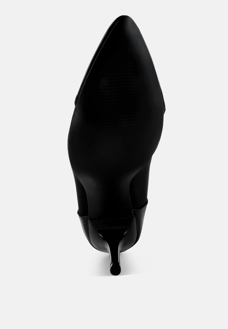 Black pointed-toe pump heel view showing back seam and ankle strap