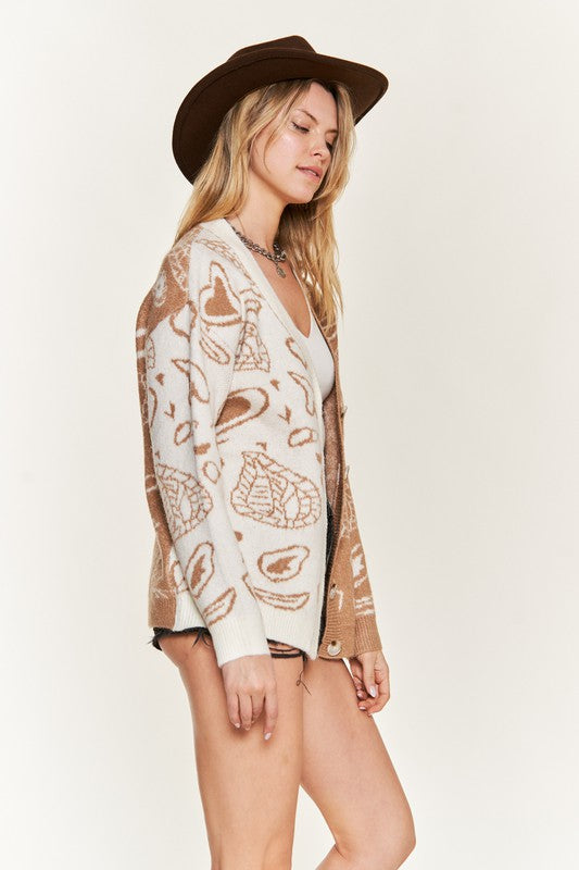 Side view: taupe-and-ivory heart paisley cardigan with ribbed cuffs