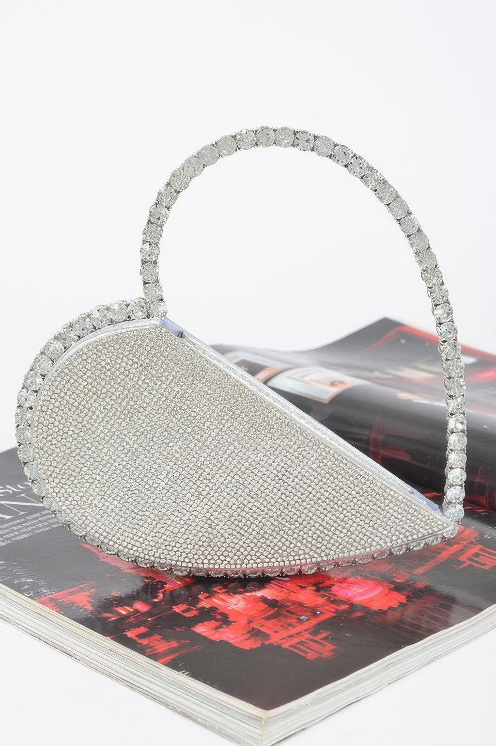 Heart-shaped rhinestone bag in silver with open top and textured sparkle finish