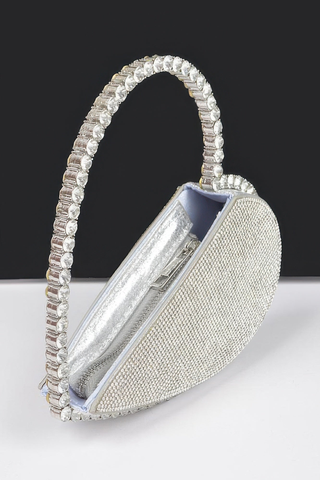 Silver heart rhinestone bag with zipper opening and satin-like inner lining