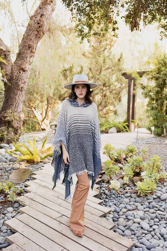 Herringbone tweed hooded poncho, dark blue/gray with striped bands and fringe
