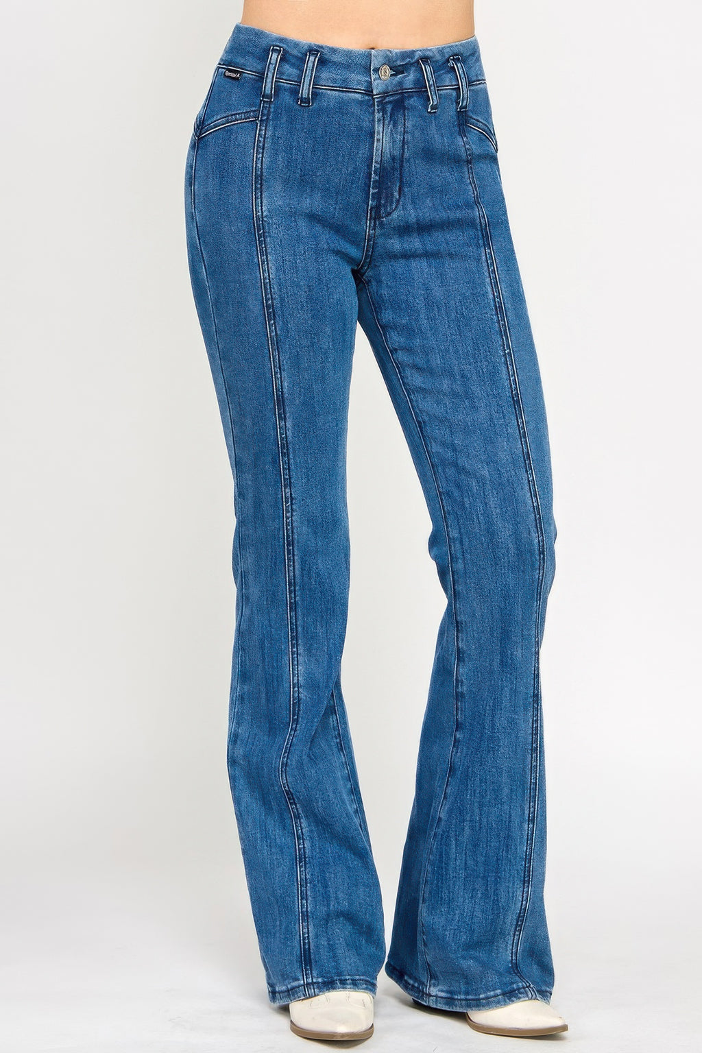 Blue denim bell-bottom jeans, back yoke seam and stitched panels