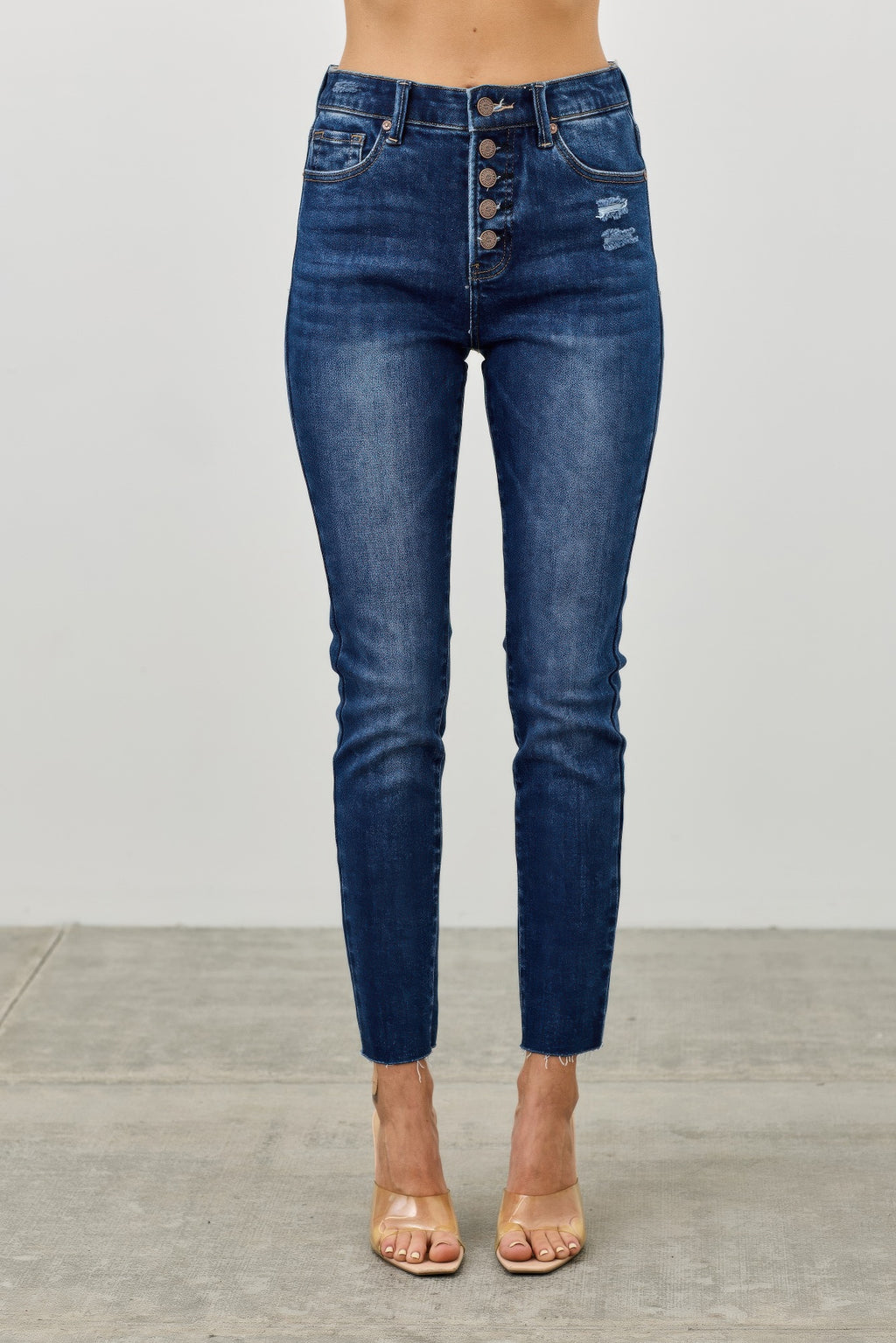 High-rise ankle skinny jeans, dark blue wash, button-fly and back pockets