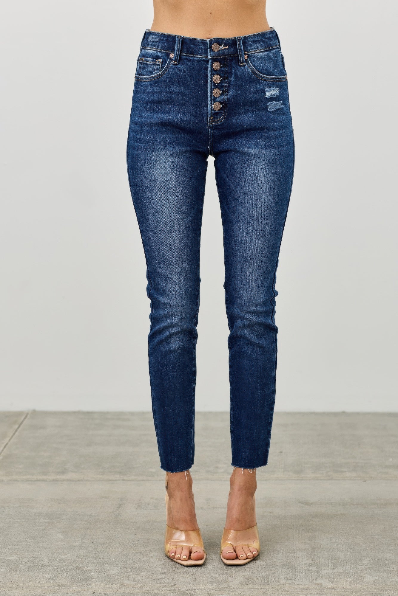 High-rise ankle skinny jeans, dark blue wash, button-fly and back pockets