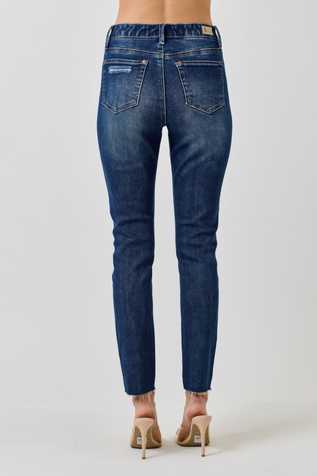 High-rise ankle skinny jeans in dark blue denim, back pockets and belt loops