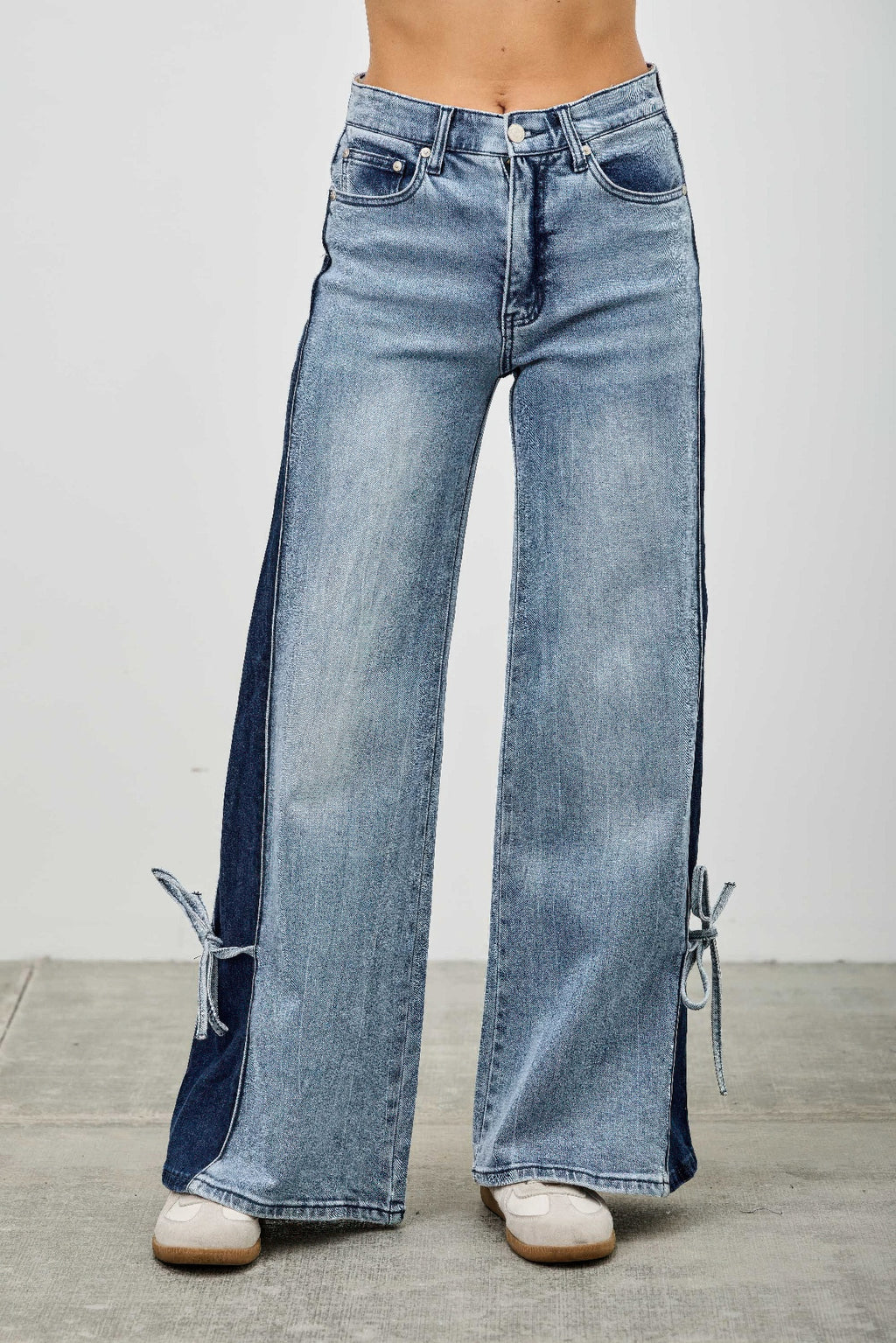 High-rise wide-leg jeans with contrast side panels and ribbon-tie detail at hems