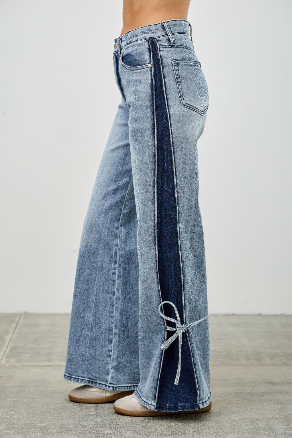 High-rise wide-leg jeans with contrast side paneling and ribbon-tie at the back hem