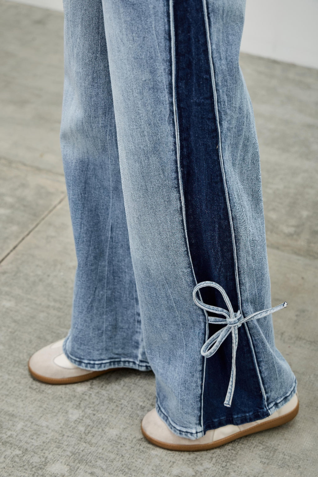 Contrast side stripe wide-leg jeans in light denim with ribbon ankle tie