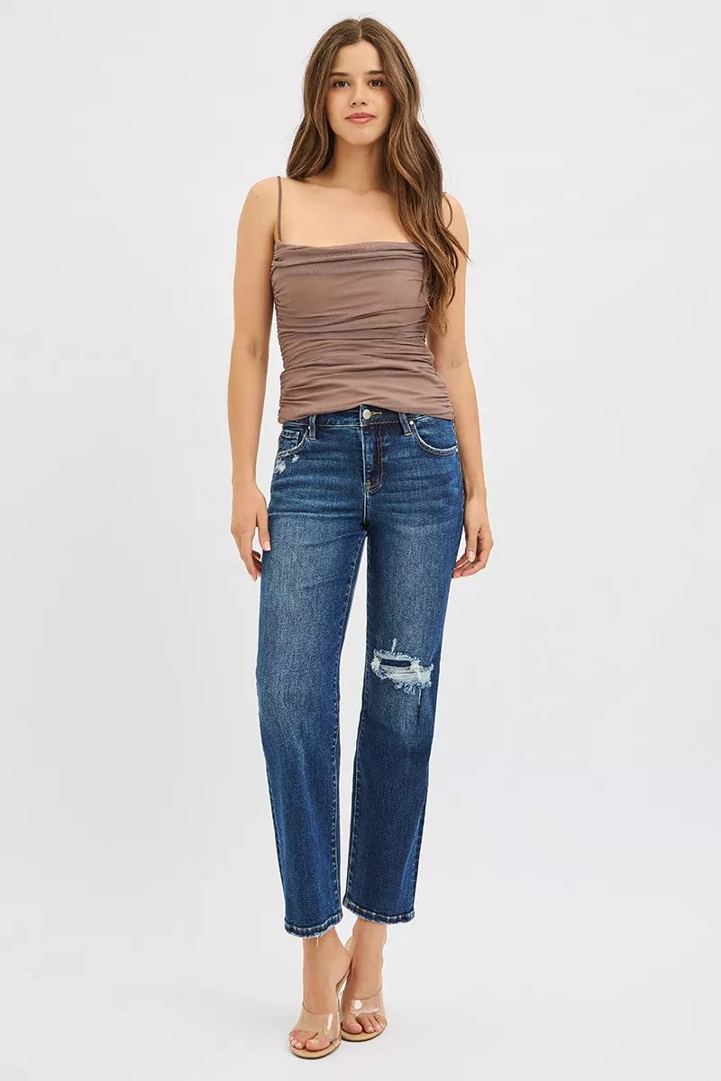 Dark blue high-rise crop slim straight jeans with distressed knee patch and cuffed hem