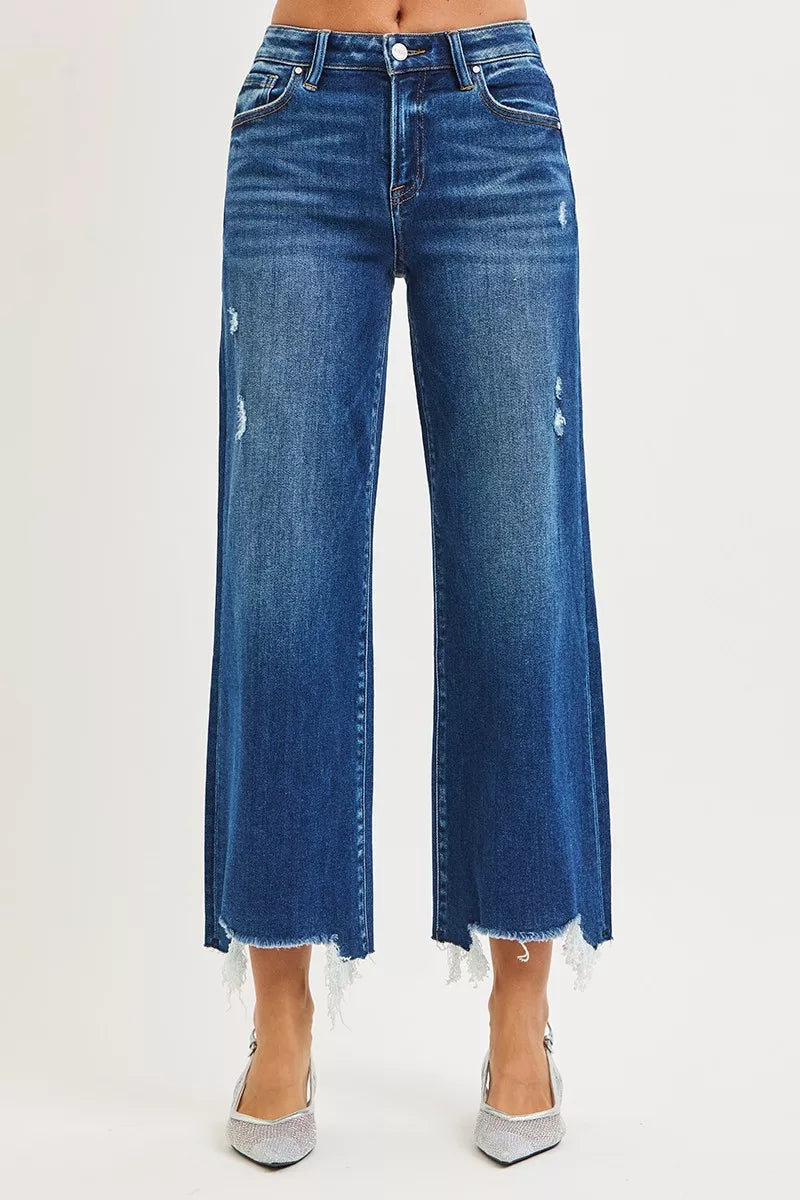 High-rise dark blue wide-leg jeans with distressing and uneven frayed hem