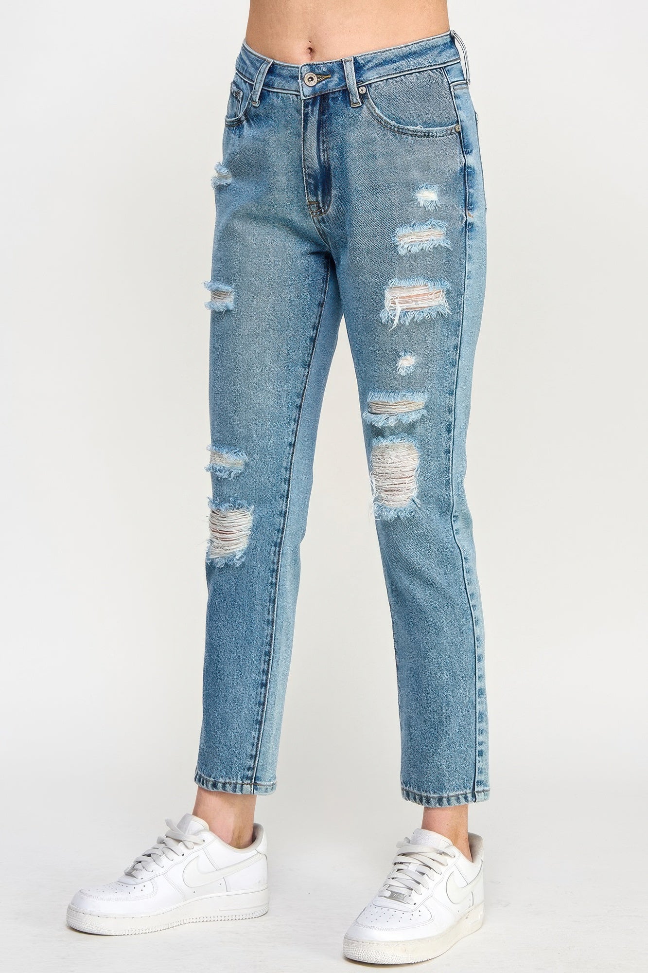 High-rise relaxed straight jeans, light blue wash with patchy knee and thigh rips