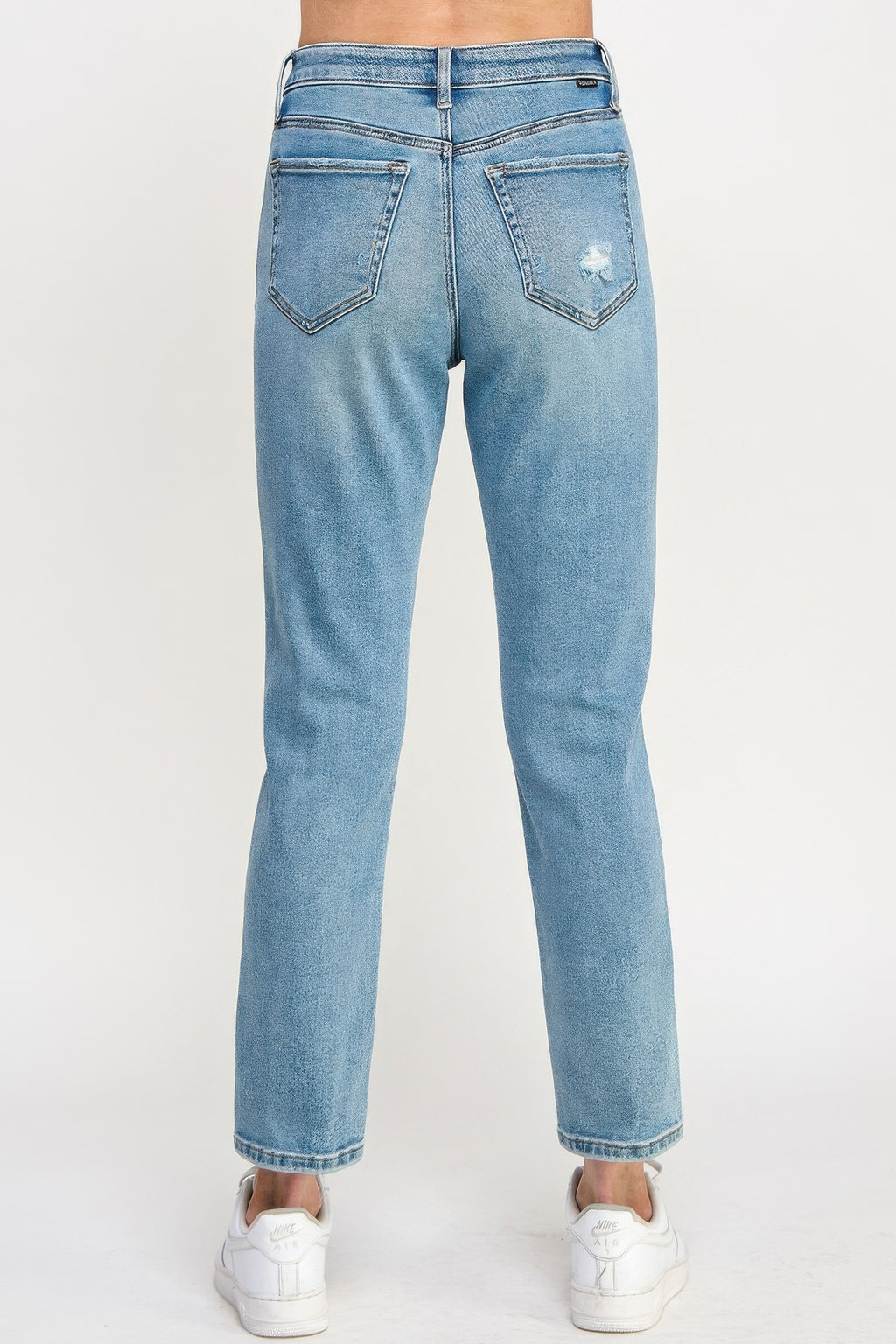 High-rise relaxed straight jeans back view in light blue with two rear pockets
