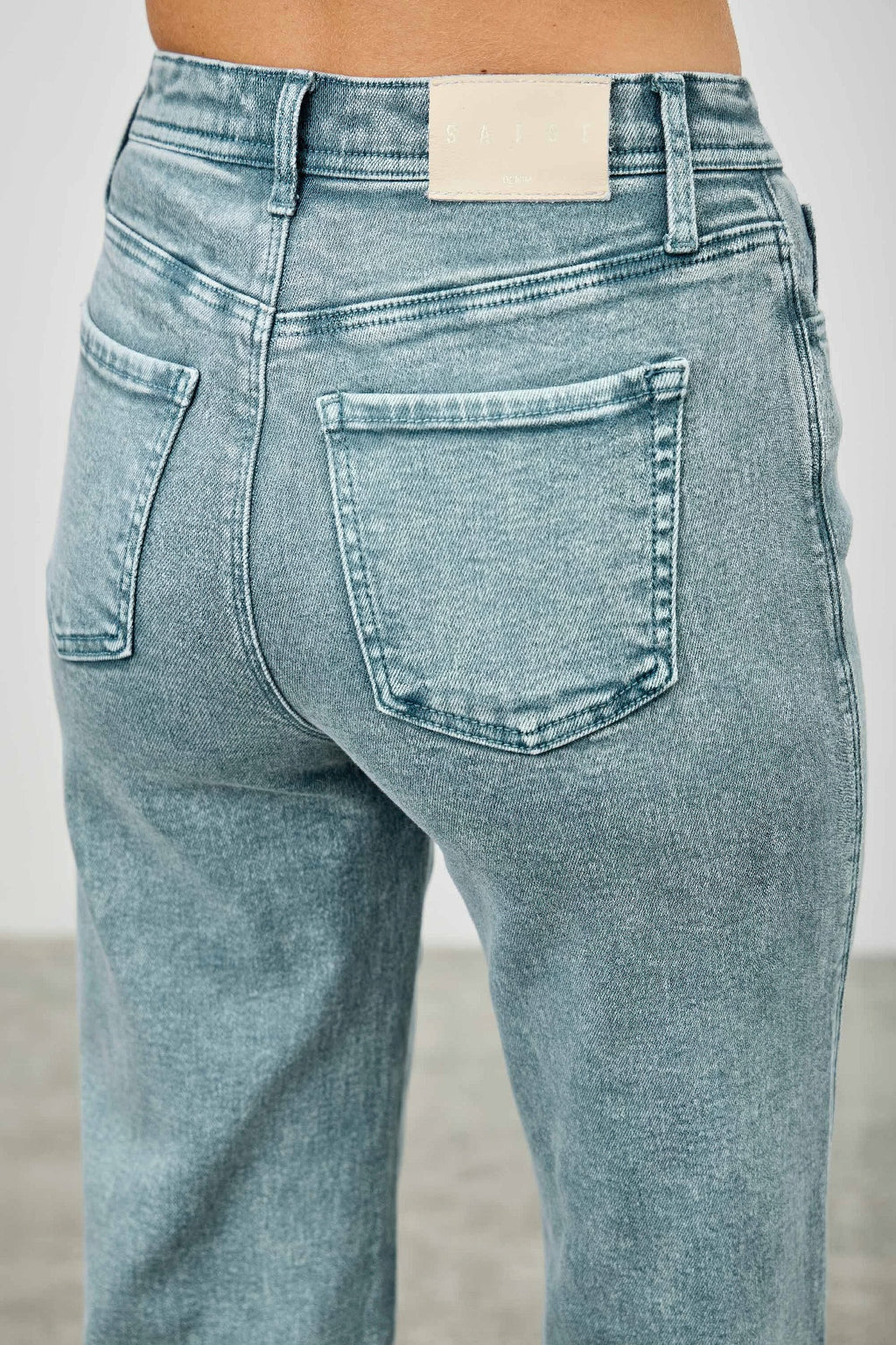 High-rise slim wide straight jeans in light wash, front button and coin pocket