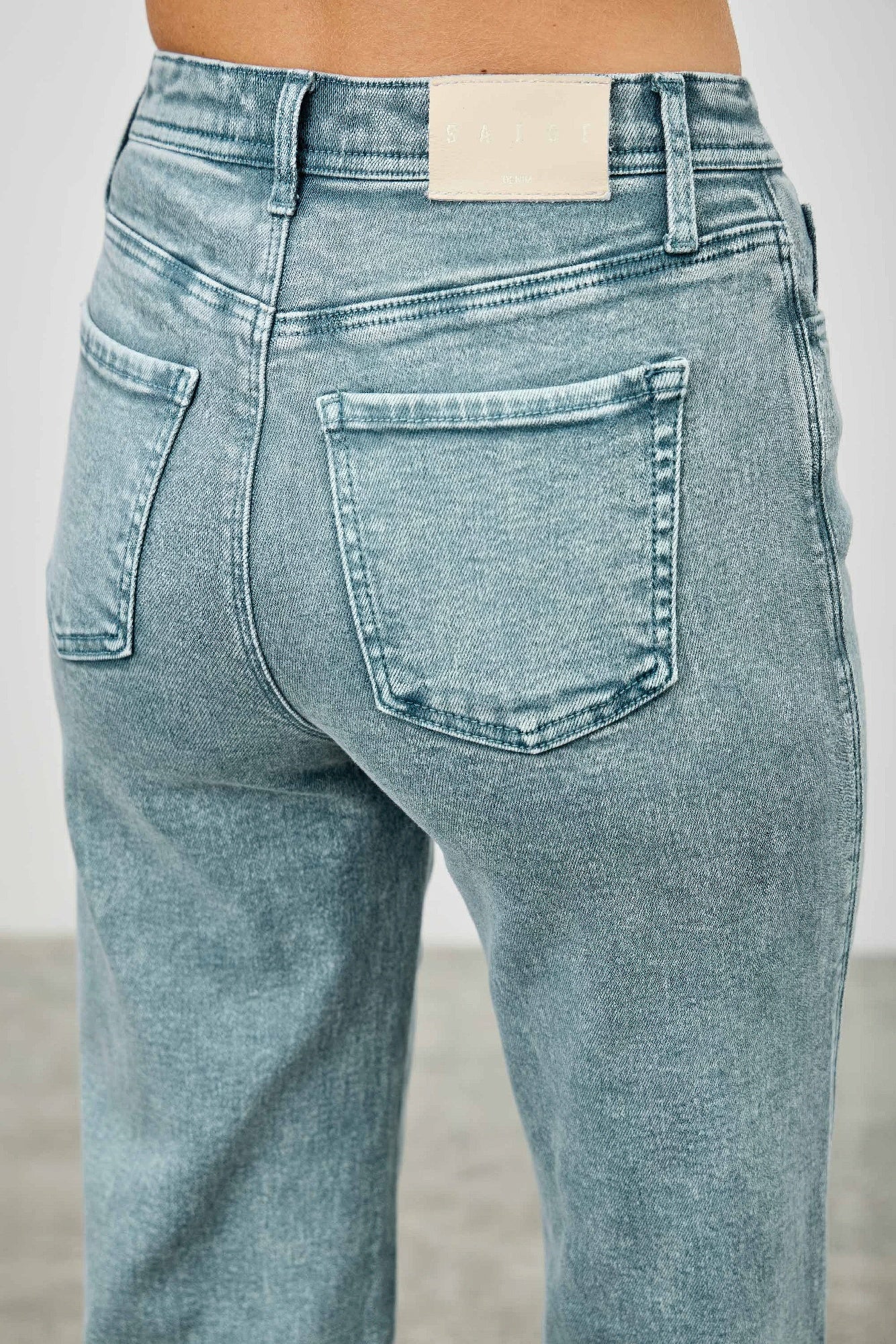 High-rise slim wide straight jeans in light wash, front button and coin pocket