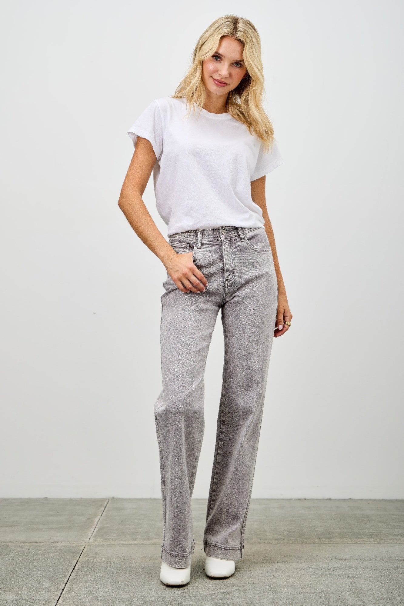 High rise jeans with front pockets and belt loops, light gray wash, straight wide leg.