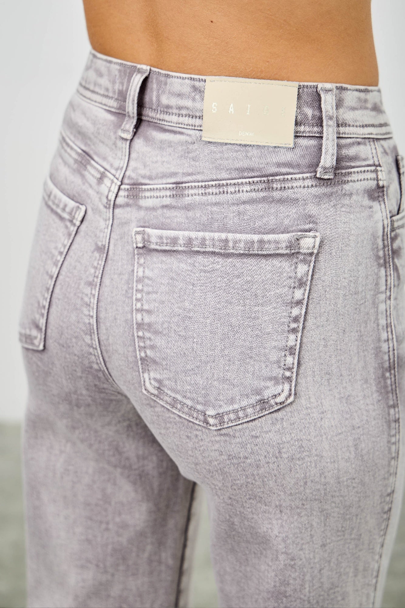 High-rise slim wide straight jeans, light gray denim, front pocket detail