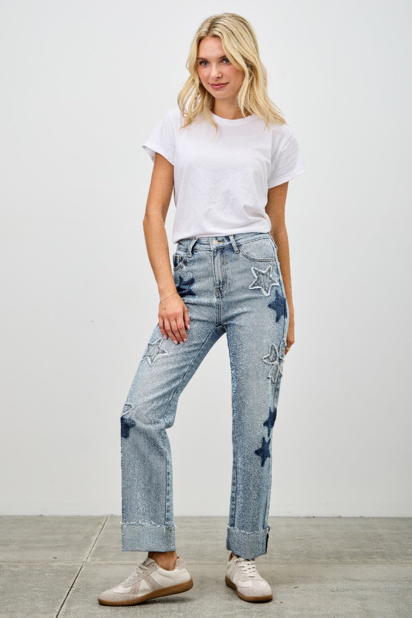 High-rise dad jeans, light blue wash, star and heart patches, wide leg opening