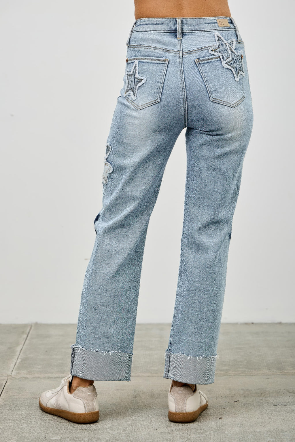 High-rise stretch dad jeans with star patches on both front pockets